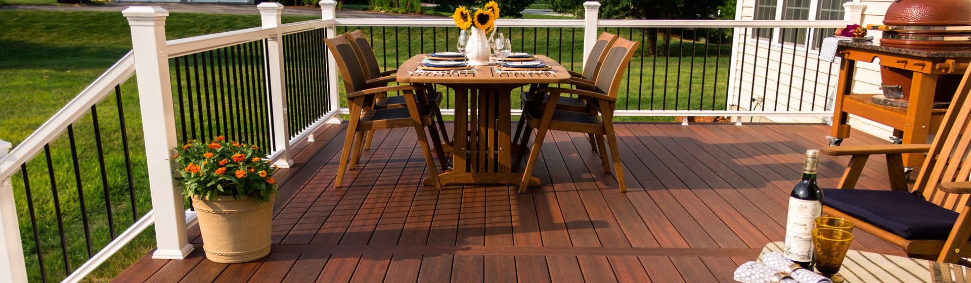 Custom deck design in Fox Chapel, Pittsburgh featuring a spacious wooden deck with unique railings and stylish outdoor seating.
