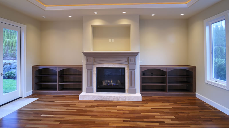 Custom carpentry project in Pittsburgh and surrounding neighborhoods featuring handcrafted wood fireplace mantel and trim in a residential home.